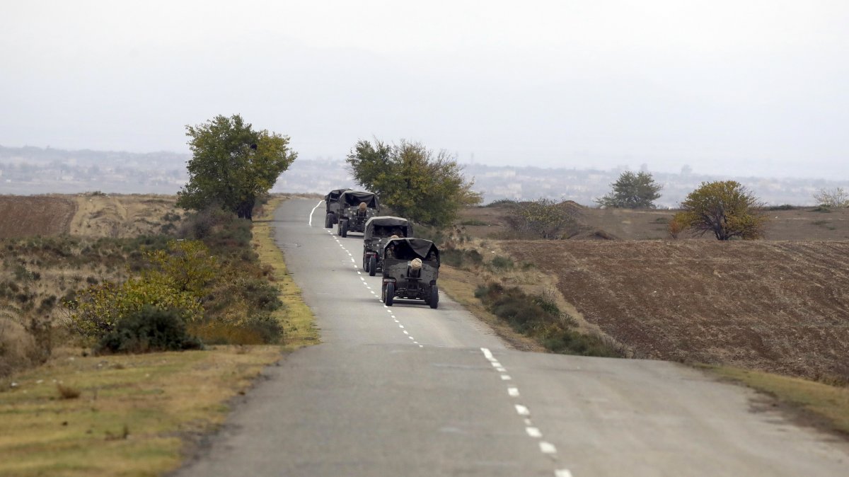 Armenian military trucks pulling cannons drive on a road during the withdrawal of Armenian troops from Karabakh, Thursday, Nov. 19, 2020. (AP File Photo)