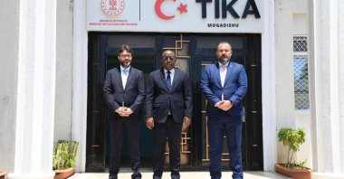 Türkiye’s Ambassador to Somalia Alper Aktaş (L) with Somali Information Minister Daud Aweys Jama (C) at TIKA&#039;s office, Mogadishu, Somalia, Oct. 26, 2025. (AA Photo)