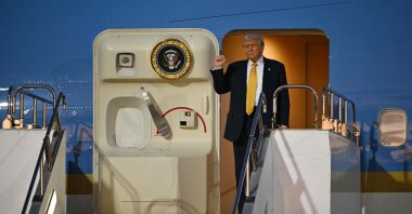 U.S. President Donald Trump gestures as he prepares to alight from Air Force One upon arrival at Haneda Airport, Tokyo, Japan, Oct. 27, 2025. (AFP Photo)