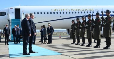 British Prime Minister Keir Starmer and Defense Minister Yaşar Güler greet honor guards at Ankara Airport, Türkiye, Oct. 27, 2025. (AA Photo)