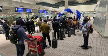 Passengers queue to check in for a direct flight from Guangzhou to Kolkata at the international airport, Guangzhou, China, Oct. 27, 2025. (AFP Photo)