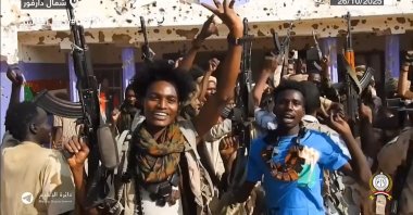 Fighters of Sudan&#039;s Rapid Support Forces celebrate in the streets of el-Fasher in Darfur, Sudan, Oct. 26, 2025. (AFP Photo)
