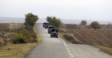 Armenian military trucks pulling cannons drive on a road during the withdrawal of Armenian troops from Karabakh, Thursday, Nov. 19, 2020. (AP File Photo)