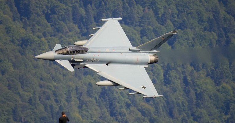 A Eurofighter Typhoon German Air Force aircraft flies by during a show of military and acrobatic aviation near the Heroes Cross on Caraiman Peak on top of the Bucegi mountains, Busteni, Romania, Aug. 26, 2025. (AP Photo)