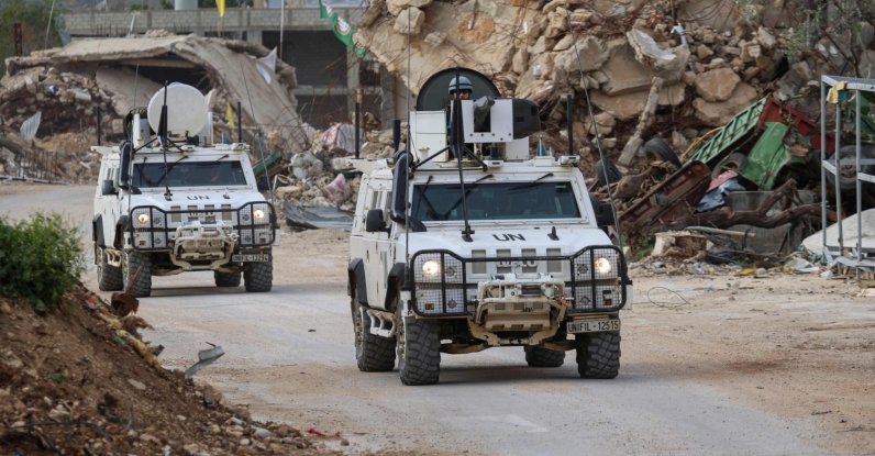 U.N. peacekeepers drive in past destroyed buildings while patrolling in Lebanon's southern village of Kfar Kila close to the border with Israel, April 6, 2025. (AFP Photo)