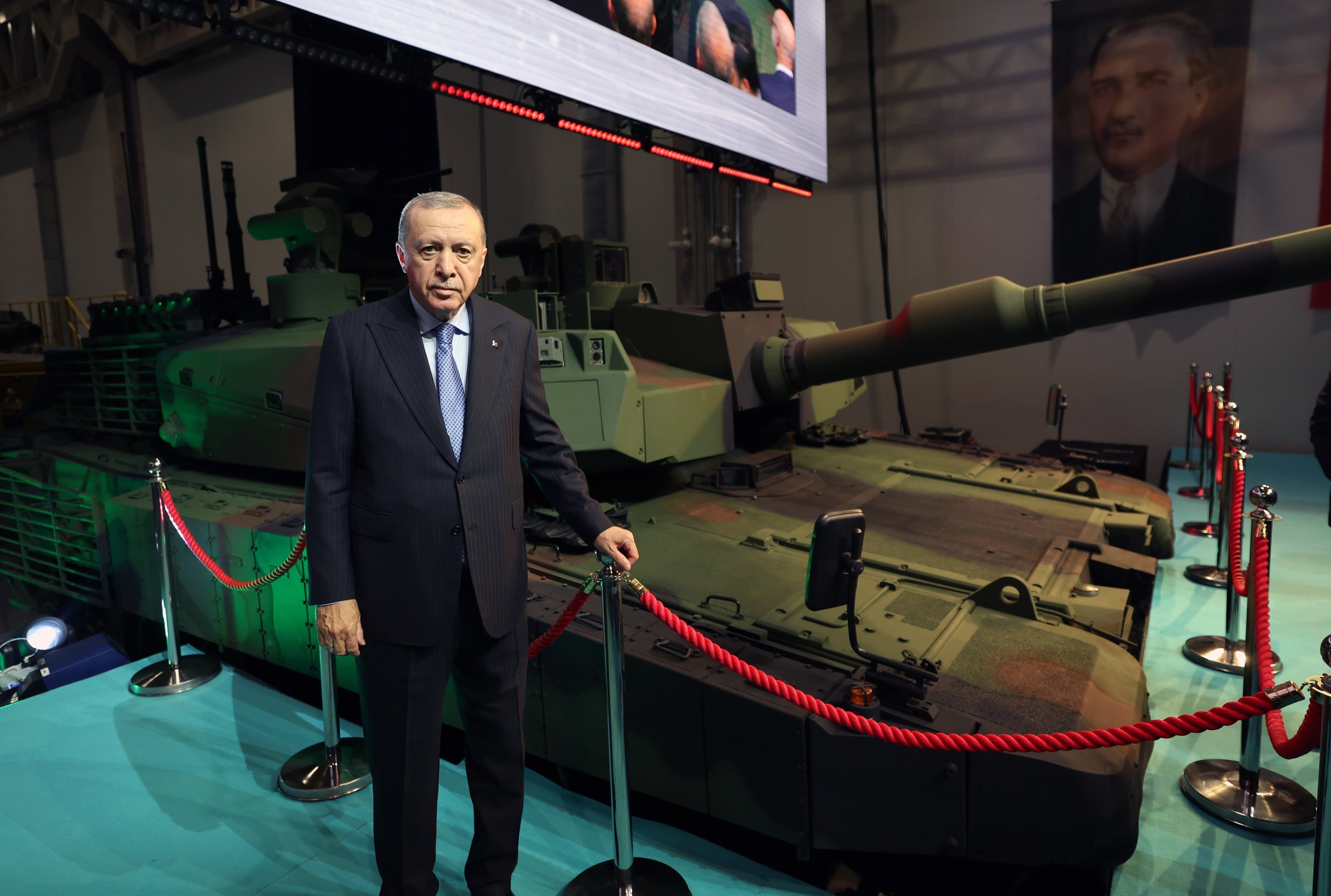 President Recep Tayyip Erdoğan poses beside Türkiye's indigenous Altay main battle tank, Ankara, Türkiye, Oct. 28, 2025. (AA Photo)