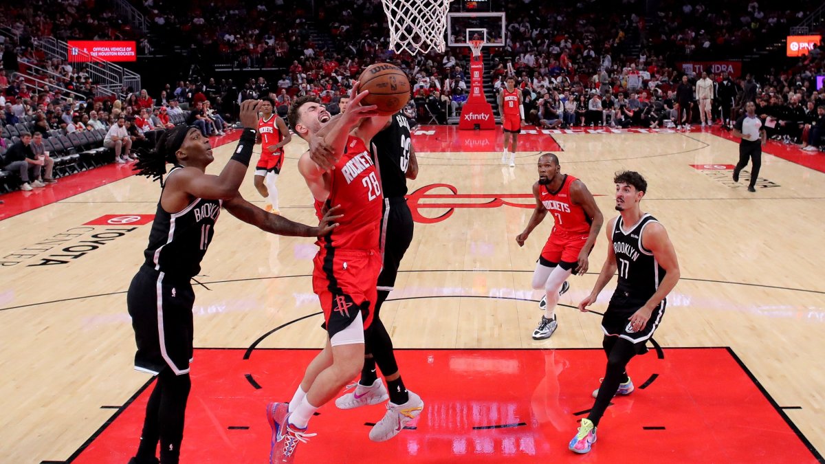 Houston Rockets' Alperen Şengün (2nd L) is fouled while shooting inside by Brooklyn Nets center Nic Claxton (L) during the third quarter at Toyota Center, Houston, U.S., Oct. 27, 2025. (Reuters Photo)
