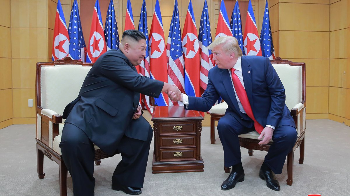 North Korean leader Kim Jong Un (L) and U.S. President Donald Trump shake hands inside the Freedom House on the southern side of Panmunjom, South Korea, June 30, 2019. (AP Photo)