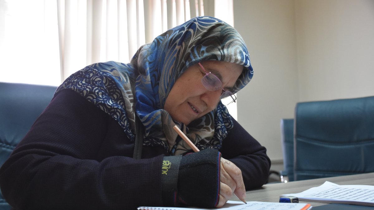 Hatun Altıntaş, 70, practices writing during a literacy course in Torul, Gümüşhane, Türkiye, Oct. 28, 2025. (AA Photo)