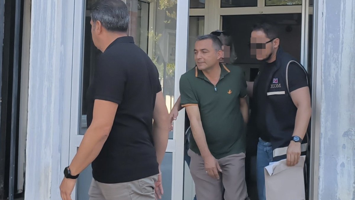 Police officers escort Manavgat Mayor Niyazi Nefi Kara after his detention, Antalya, Türkiye, July 8, 2025. (IHA Photo)