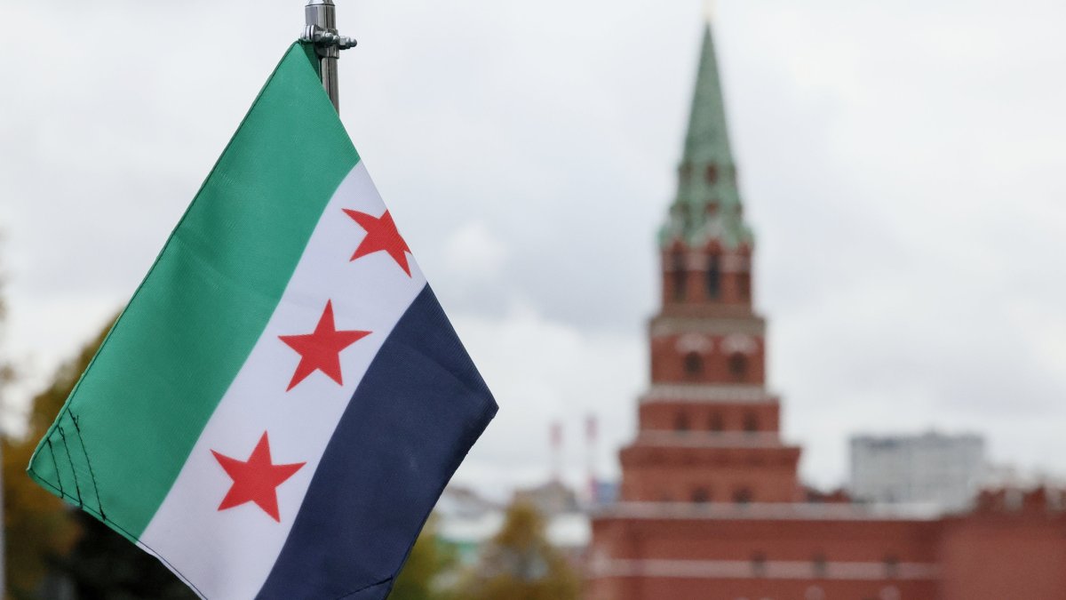 A view shows a Syrian flag attached to a car in the motorcade transporting Syrian interim President Ahmed al-Sharaa before his meeting with the Russian president in Moscow, Russia, Oct. 15, 2025.  (EPA via Kremlin Pool Photo, File)