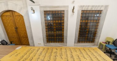 The world’s largest handwritten Quran, measuring 4 meters long and 1.5 meters wide per page, is displayed in a room, Istanbul, Türkiye, Oct. 9, 2025. (AA Photo)