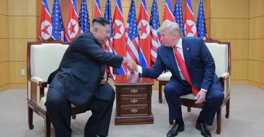 North Korean leader Kim Jong Un (L) and U.S. President Donald Trump shake hands inside the Freedom House on the southern side of Panmunjom, South Korea, June 30, 2019. (AP Photo)