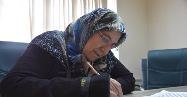 Hatun Altıntaş, 70, practices writing during a literacy course in Torul, Gümüşhane, Türkiye, Oct. 28, 2025. (AA Photo)