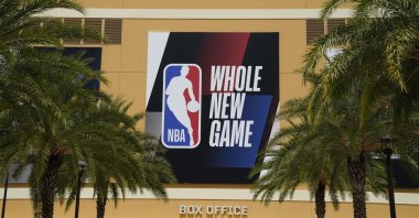 An NBA logo is displayed outside a basketball arena, Lake Buena Vista, U.S., Aug. 28, 2020. (AP Photo)