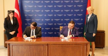 Türkiye&#039;s Ambassador to Belarus Güçlü Cem Işık (L) and Belarusian Deputy Foreign Minister Yevgeny Shestakov sign a protocol, Minsk, Belarus, July 21, 2025. (AA Photo)