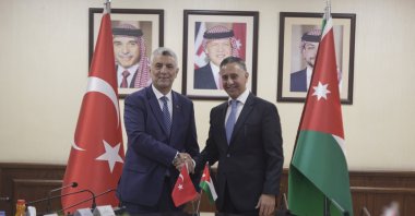 Trade Minister Ömer Bolat (L) shakes hands with Jordan&#039;s Minister of Industry, Trade and Supply Yarub al-Qudah, Amman, Jordan, Oct. 28, 2025. (AA Photo)