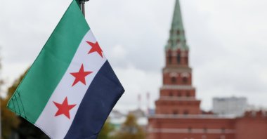A view shows a Syrian flag attached to a car in the motorcade transporting Syrian interim President Ahmed al-Sharaa before his meeting with the Russian president in Moscow, Russia, Oct. 15, 2025.  (EPA via Kremlin Pool Photo, File)