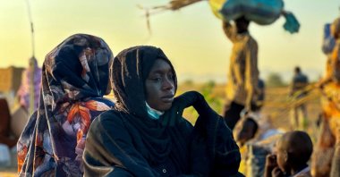 A displaced woman rests after fleeing el-Fasher following the city’s fall to the RSF, Tawila, western Darfur region, Sudan, Oct. 28, 2025. (Photo by AFP)