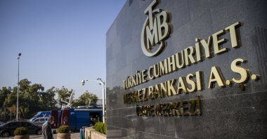 A man passes by the headquarters of the Central Bank of the Republic of Türkiye (CBRT), Ankara, Türkiye, Oct. 28, 2021. (AA File Photo)