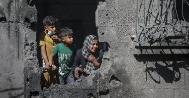 Palestinians look out from their family&#039;s destroyed house following an Israeli airstrike in al Shatea refugee camp in Gaza City, Palestine, Oct. 29, 2025. (EPA Photo)