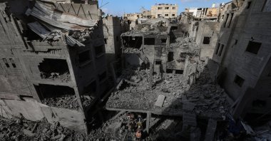 Palestinians survey the damage amongst the rubble of destroyed houses following an Israeli airstrike targeting a residential block in Al Shatea refugee camp in Gaza City, Oct. 29, 2025. (EPA Photo)