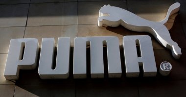 The logo of German sports goods firm Puma is seen at the entrance of one of its stores in Vienna, Austria, March 18, 2016. (Reuters Photo)