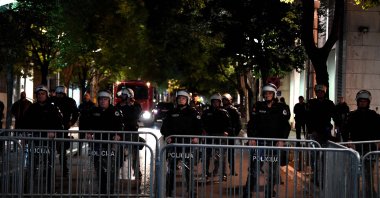Montenegrin police officers stand guard as mobs gather in the tiny nation&#039;s capital, Podgorica, Montenegro, Oct. 28, 2025, (AFP Photo)