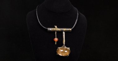 This undated photo provided by the Oakland Museum of California shows the Rutilated Quartz Dome Neckpiece by Florence Resnikoff at the Oakland Museum of California, in Oakland, California, U.S., Oct. 30, 2025.  (AP Photo)