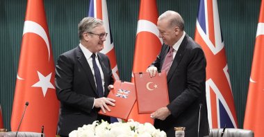 British Prime Minister Keir Starmer and President Recep Tayyip Erdoğan exchange documents after signing a deal for Typhoon fighter jets, at the Presidential Palace, Ankara, Türkiye, Oct. 27, 2025. (Reuters Photo)
