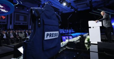 President Recep Tayyip Erdoğan delivers a speech with a press vest displayed nearby on the platform, symbolizing journalists killed by Israel while on duty in Gaza, at the TRT World Forum, Istanbul, Türkiye, Oct. 31, 2025. (AA Photo)