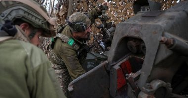 Artillerymen of the 82nd Separate Airborne Assault Brigade of the Ukrainian Armed Forces prepare to fire a D-30 howitzer towards Russian troops, amid Russia&#039;s attack on Ukraine, near the frontline town of Dobropillia in Donetsk region, Ukraine, Oct. 29, 2025. (Reuters Photo)