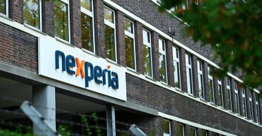 The logo of Chinese-owned semiconductor company Nexperia is displayed at the chipmaker&#039;s German facility, after the Dutch government seized control and auto industry bodies sounded the alarm over the possible impact on car production, in Hamburg, Germany, Oct. 23, 2025. (Reuters Photo)