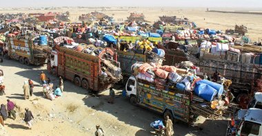 Afghan refugees along with their belongings on trucks await deportation to Afghanistan near the Pakistan-Afghanistan border in Chaman, Pakistan, Oct. 29, 2025. (AFP Photo)