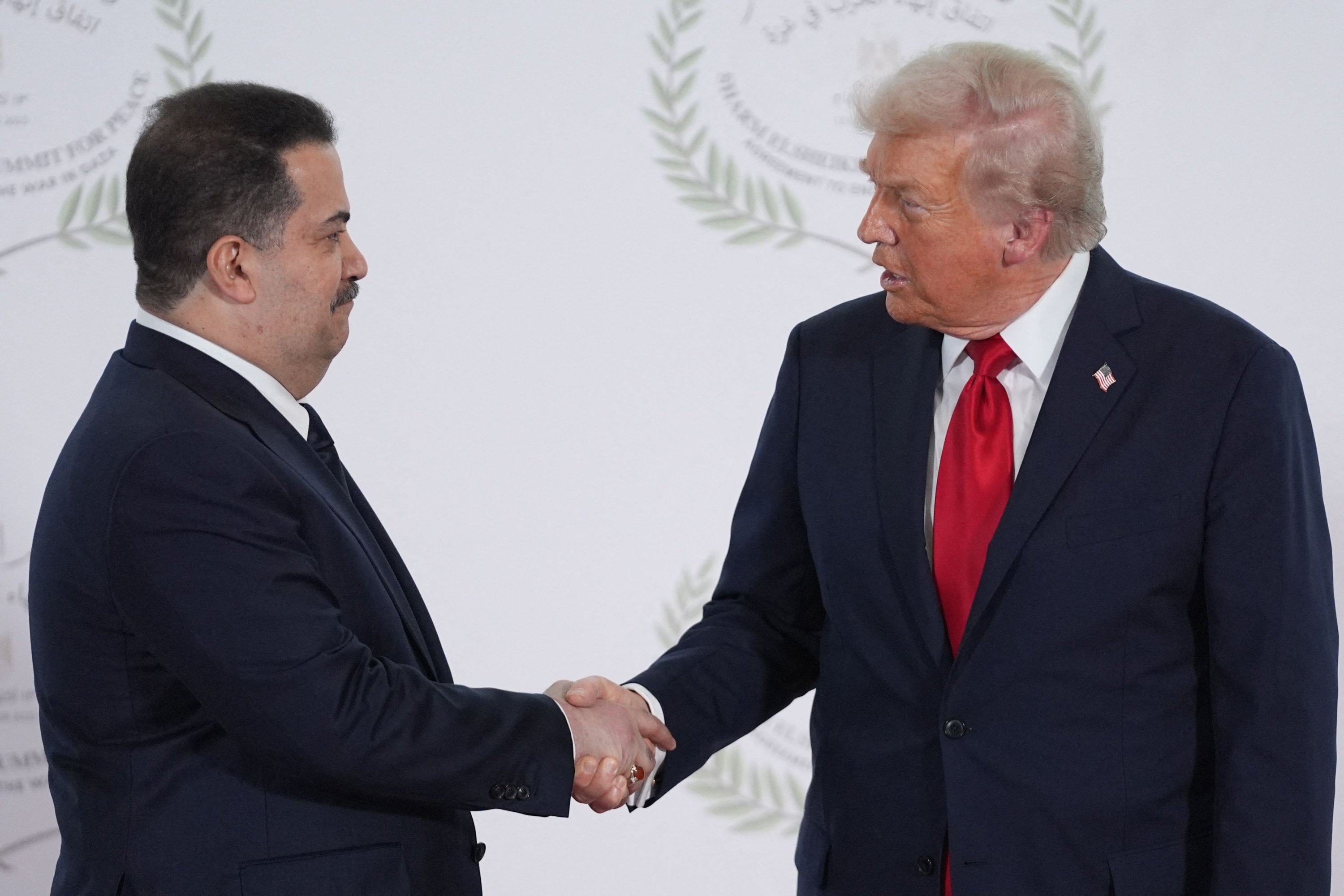 U.S. President Donald Trump greets Iraq's Prime Minister Mohammed S. al Sudani during a summit on Gaza, Sharm el-Sheikh, Egypt, Oct. 13, 2025. (AFP Photo)