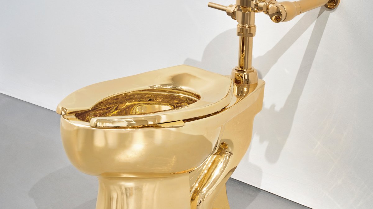 Sotheby’s has announced it will auction a solid gold toilet, a sculpture by Italian artist Maurizio Cattelan called “America.” The auction is set for Nov. 18 in New York. (AP Photo)