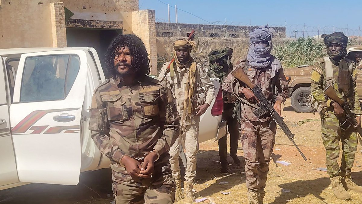 The Rapid Support Forces (RSF) members reportedly detain a fighter known as Abu Lulu (L) in El-Fasher, western Darfur region, Sudan, Oct. 30, 2025. (AFP Photo)