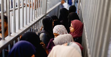 People line up outside the Bank of Palestine amid a cash shortage, Nuseirat, central Gaza Strip, Palestine, Oct. 27, 2025. (Reuters Photo)