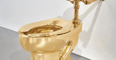 Sotheby’s has announced it will auction a solid gold toilet, a sculpture by Italian artist Maurizio Cattelan called “America.” The auction is set for Nov. 18 in New York. (AP Photo)
