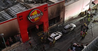 Emergency teams work at the site of a Waldo&#039;s discount store following a fire, in Hermosillo, Sonora state, northwestern Mexico, Nov. 1, 2025. (EPA Photo)