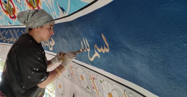 Aynur Şeker applies delicate brush strokes to the high ceiling of a mosque under construction, Samsun, Türkiye, Nov. 2, 2025. (AA Photo)