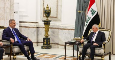 Turkish Foreign Minister Hakan Fidan (L) is received by Iraqi President Abdul Latif Rashid at the Baghdad Palace in Baghdad, Iraq, Nov. 2, 2025. (AA Photo)