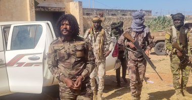 The Rapid Support Forces (RSF) members reportedly detain a fighter known as Abu Lulu (L) in El-Fasher, western Darfur region, Sudan, Oct. 30, 2025. (AFP Photo)