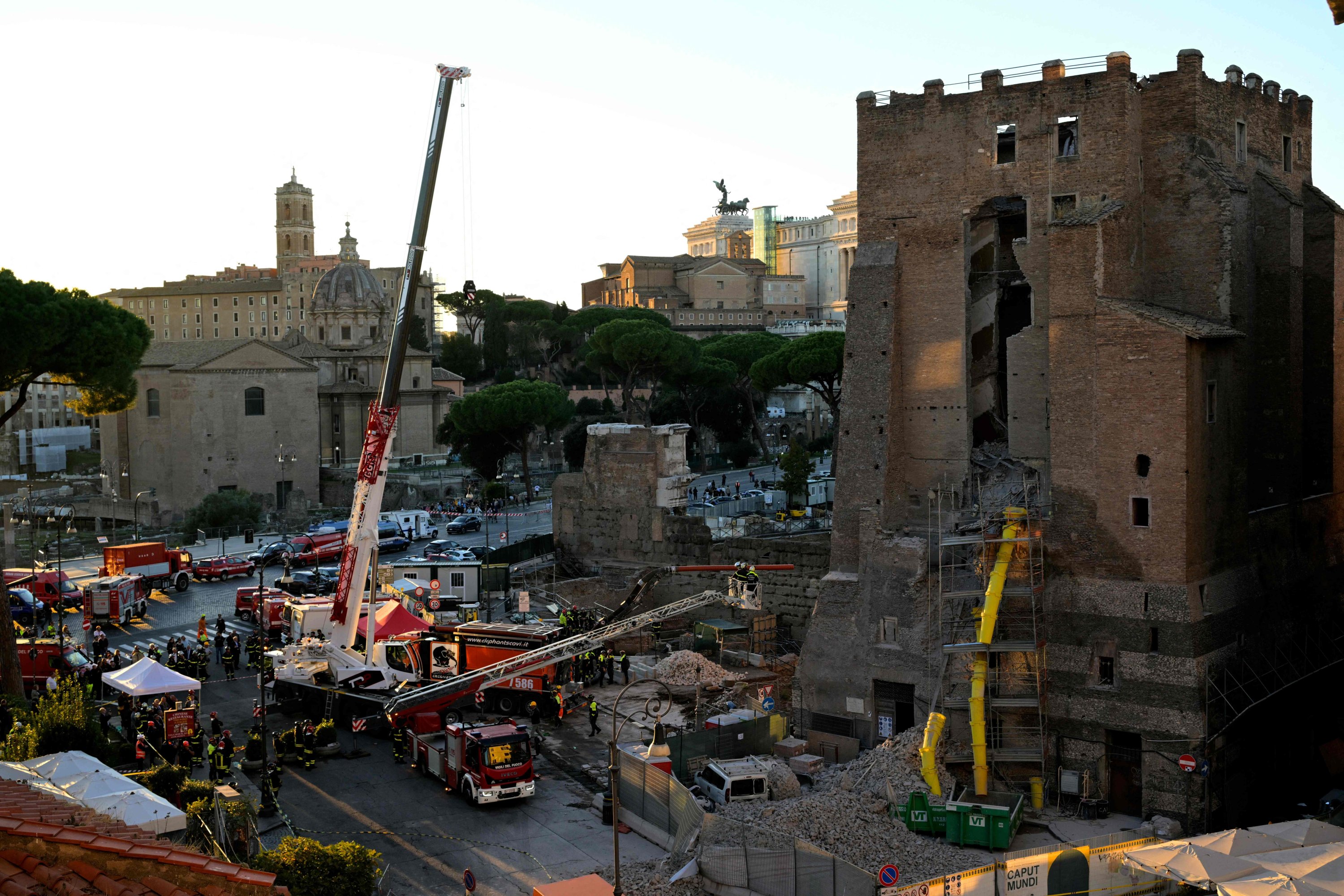 Worker trapped after medieval tower partially collapses in Rome
