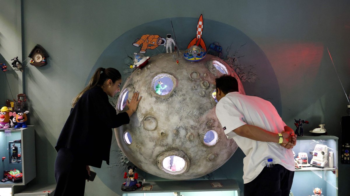 Visitors look at items displayed at a toy museum in the Iranian capital Tehran, Iran, Oct. 26, 2025. (AFP Photo)