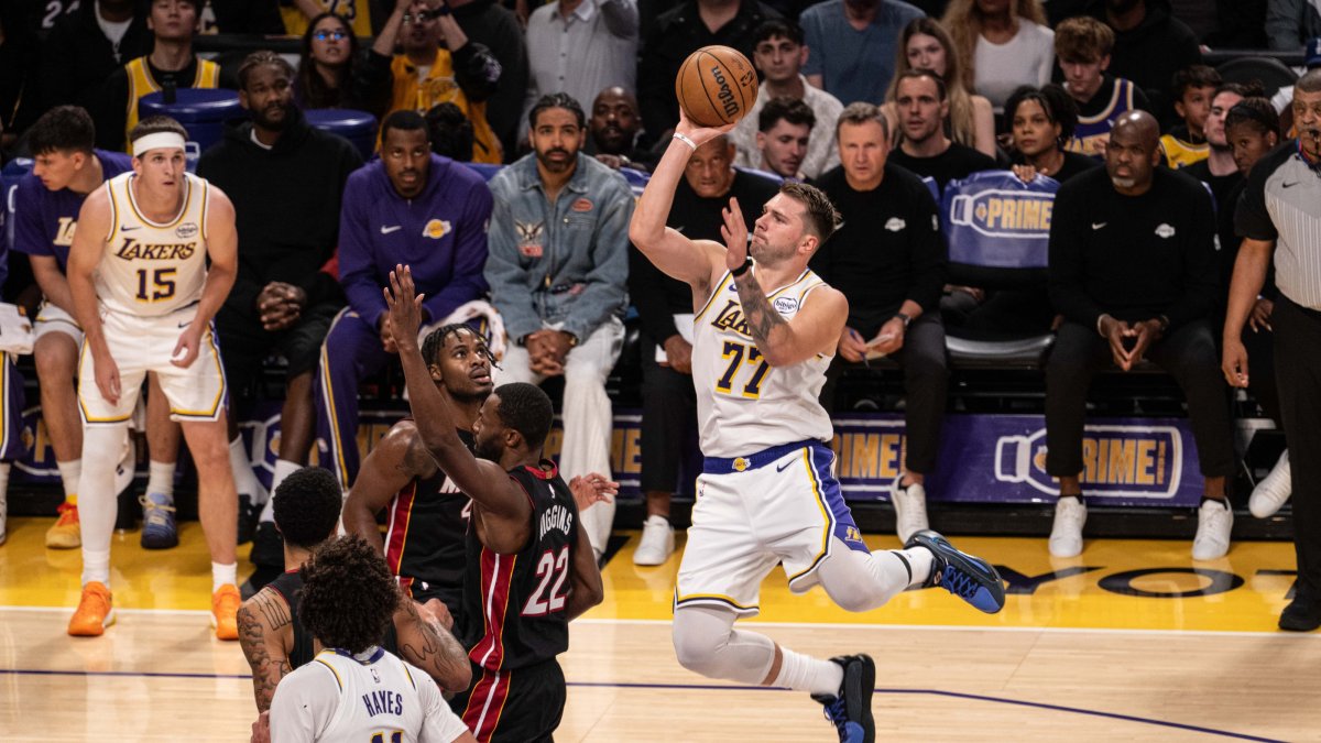 Los Angeles Lakers guard Luka Doncic (R) goes for a layup against Miami Heat defenders during an NBA game at Crypto.com Arena, Los Angeles, U.S., Nov. 3, 2025. (AA Photo)
