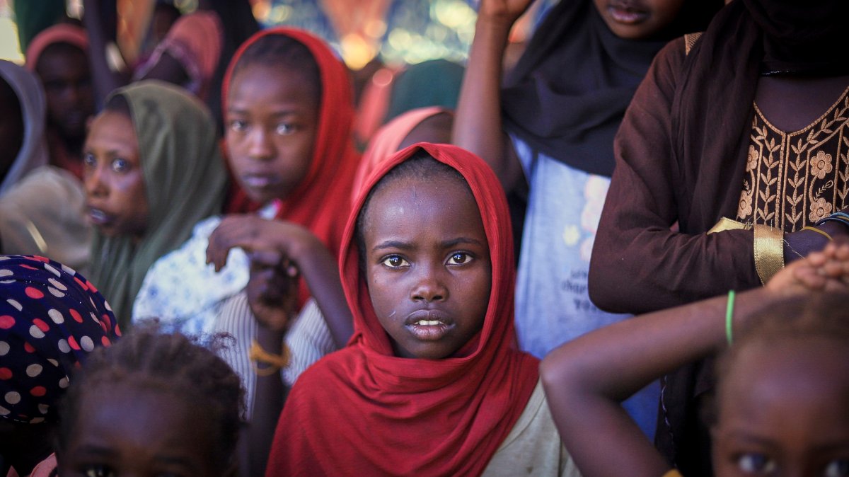 This photo released by The Norwegian Refugee Council (NRC), shows displaced women and children from el-Fasher at a camp where they sought refuge from fighting between government forces and the RSF, in Tawila, Darfur region, Sudan, Nov. 3, 2025. (AP Photo)