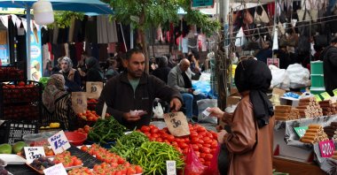 People shop at a green market in Istanbul, Türkiye, Oct. 22, 2025. (Reuters Photo)