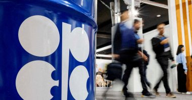 People walk past an installation depicting a barrel of oil with the logo of the Organization of the Petroleum Exporting Countries (OPEC) during the COP29 United Nations climate change conference in Baku, Azerbaijan, Nov. 19, 2024. (Reuters Photo)