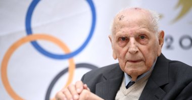 French cyclist and Olympic champion in the team pursuit during the 1948 Summer Olympics in London, Charles Coste, attends a ceremony to receive the Legion d’honneur at the headquarters of the Paris 2024 Organizing Committee for the Olympic and Paralympic Games, in Saint-Denis, Paris, France, April 13, 2022. (AFP Photo)